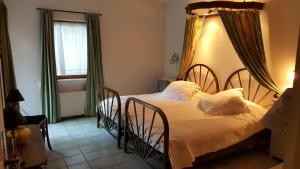 a bedroom with two beds and a window at Residence Les Rossignols in Roussillon