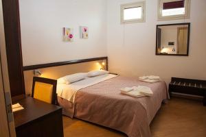 Voodi või voodid majutusasutuse Albergo Perseo toas