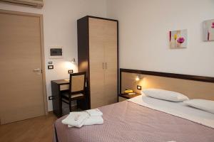 Voodi või voodid majutusasutuse Albergo Perseo toas