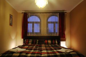Un pat sau paturi într-o cameră la Motel Orgován