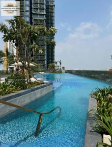 a large swimming pool in a city at Lumiere Riverside Grand Prestige Residence in Ho Chi Minh City +103 photos