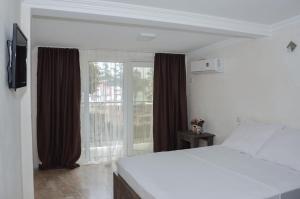 Voodi või voodid majutusasutuse Hotel Crown toas