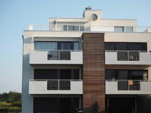 a building with balconies on the side of it at Ferienwohnung Strandblick in Großräschen