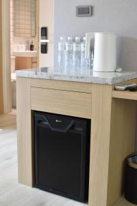 a kitchen counter with a black dishwasher under a counter top at Cheng House in Yuchi +21 photos