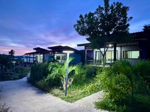 a house with a pathway in front of it at Leam Sai Seaview in Ban Laem Sai