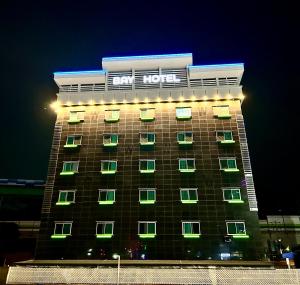 a hotel building with a sign on top of it at Song-Jeong Bay Hotel in Busan