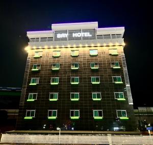 a hotel with green lights on the side of a building at Song-Jeong Bay Hotel in Busan