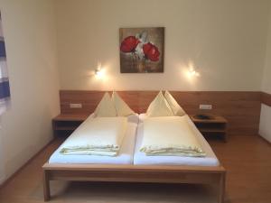 En eller flere senger på et rom på Gasthaus Hotel Feldschlange