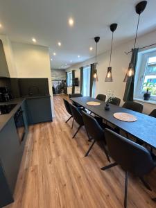 a kitchen and dining room with a table and chairs at Ferienhaus Luisl & Hilde in Unterammergau