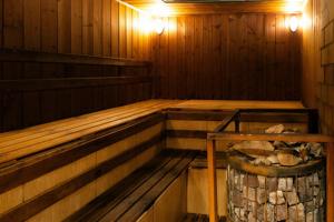 an inside of a sauna with a trash can at Садиба in Vinnytsya