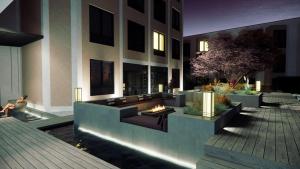a lobby of a building with a couch and a fire place at Strand Öland in Borgholm
