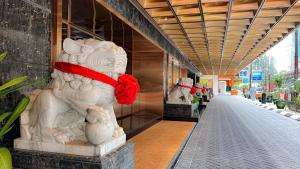 a white statue of a dog in a building at The Federal Kuala Lumpur in Kuala Lumpur