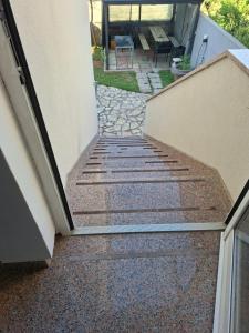 a set of stairs leading up to a house at Apartmani Željko in Zadar