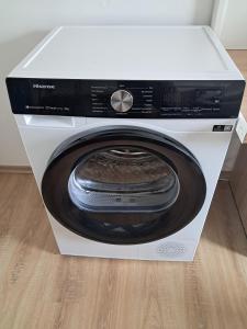 a white washing machine in a white box at Ferienwohnung Michelle in Bremerhaven