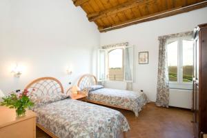 Кровать или кровати в номере Agriturismo Sesta Presa