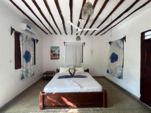 a bedroom with a bed in a room at 1Zi Beachfront Resort in Paje +184 photos