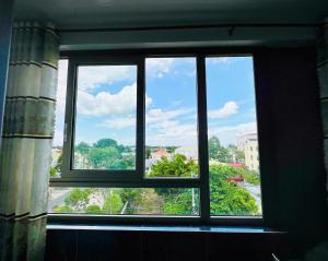 a window with a view of a city at Khách Sạn The Second in Thốt Nốt