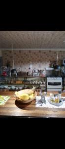 a kitchen with a bowl of fruit on a counter at 1054 Holiday Home in Kasane Airport