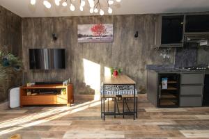 a kitchen with a counter and a table in it at Charming Duplex Mauritius' Little Venice in Terre Rouge +30 photos