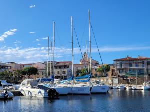 a group of boats docked in a harbor at Villa il Gabbiano Stintino in Stintino