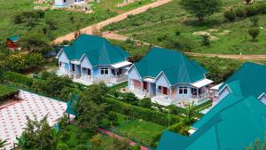 an overhead view of a house with blue roofs at JK Maasai Hotel in Wasso