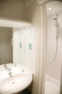 Koupelna v ubytování Hotel Till Eulenspiegel - Nichtrauchhotel - Garni