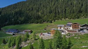 an aerial view of a resort in a mountain at Berghotel & Gasthof Marlstein in Oetz