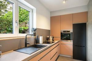 a kitchen with a sink and a window at Ferienwohnung Sigi in Traben-Trarbach