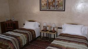 Posteľ alebo postele v izbe v ubytovaní Elmalara