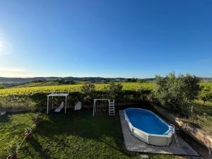 a garden with a swimming pool and a boat at SlowCasa - VILLA Garden & Pool - Full Apartment in Torrevecchia Teatina