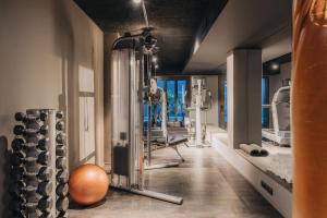a gym with a bunch of exercise equipment at Uma House by Yurbban Trafalgar in Barcelona