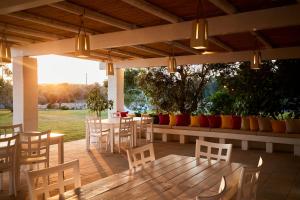 a patio with a table and chairs and a table and chairsktop at Tenuta Montiro' in Leuca