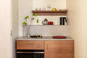 a small kitchen with a counter and a counter top at Bob W Stockholm Södermalm in Stockholm