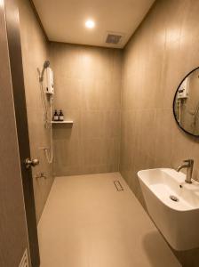 a bathroom with a sink and a mirror at Cloud Nest House Betong in Betong