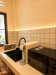 a kitchen with a mixer on a kitchen counter at Cloud Nest House Betong in Betong
