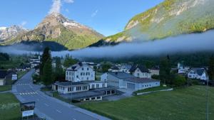 a town in a valley with a mountain at Adler in Linthal