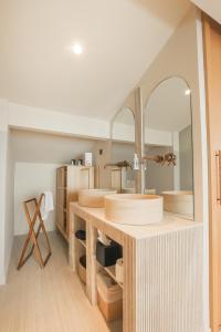 a bathroom with two sinks and a mirror at Tinah Saint-Tropez in Saint-Tropez