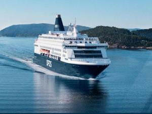 a large cruise ship traveling on the water at FLC 11 Rooms in Rødby