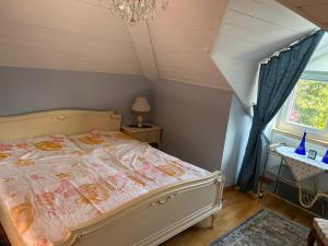 a bedroom with a bed and a window at Bergblick Apartment in Lienz