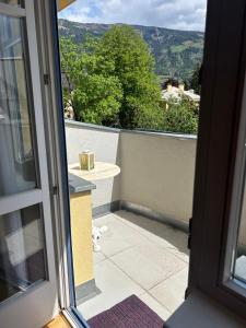 an open door to a balcony with a view at Bergblick Apartment in Lienz