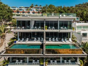 an aerial view of a building with a swimming pool at Villa Momo seaview pool & game room Kata in Kata Beach