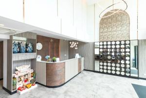 a lobby of a store with a counter at ABC@48 Hotel & Service Apartment in Bangkok