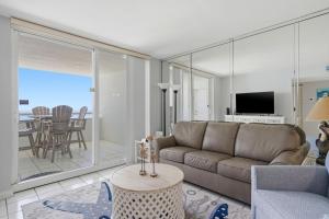 a living room with a couch and a table at Perdido Sun 1008 in Perdido Key