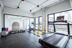a gym with a treadmill and exercise equipment in a building at ABC@48 Hotel & Service Apartment in Bangkok