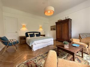 a living room with a bed and a couch at Gure gostuan in Itxassou