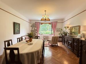 a dining room with a table and a window at Gure gostuan in Itxassou +33 photos