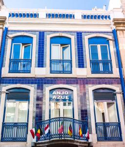 a blue and white building with two windows at Anjo Azul in Lisbon