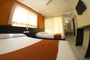 Postel nebo postele na pokoji v ubytování Hotel & Suites Domani