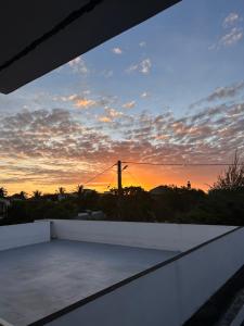 a view of a sunset from the roof of a house at Serenity Apartments in Albion