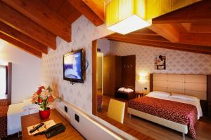Hotel Eridano tesisinde bir odada yatak veya yataklar